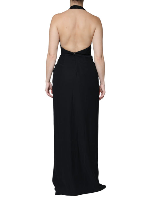A long black halter dress with a sleeveless design and a sheath silhouette
