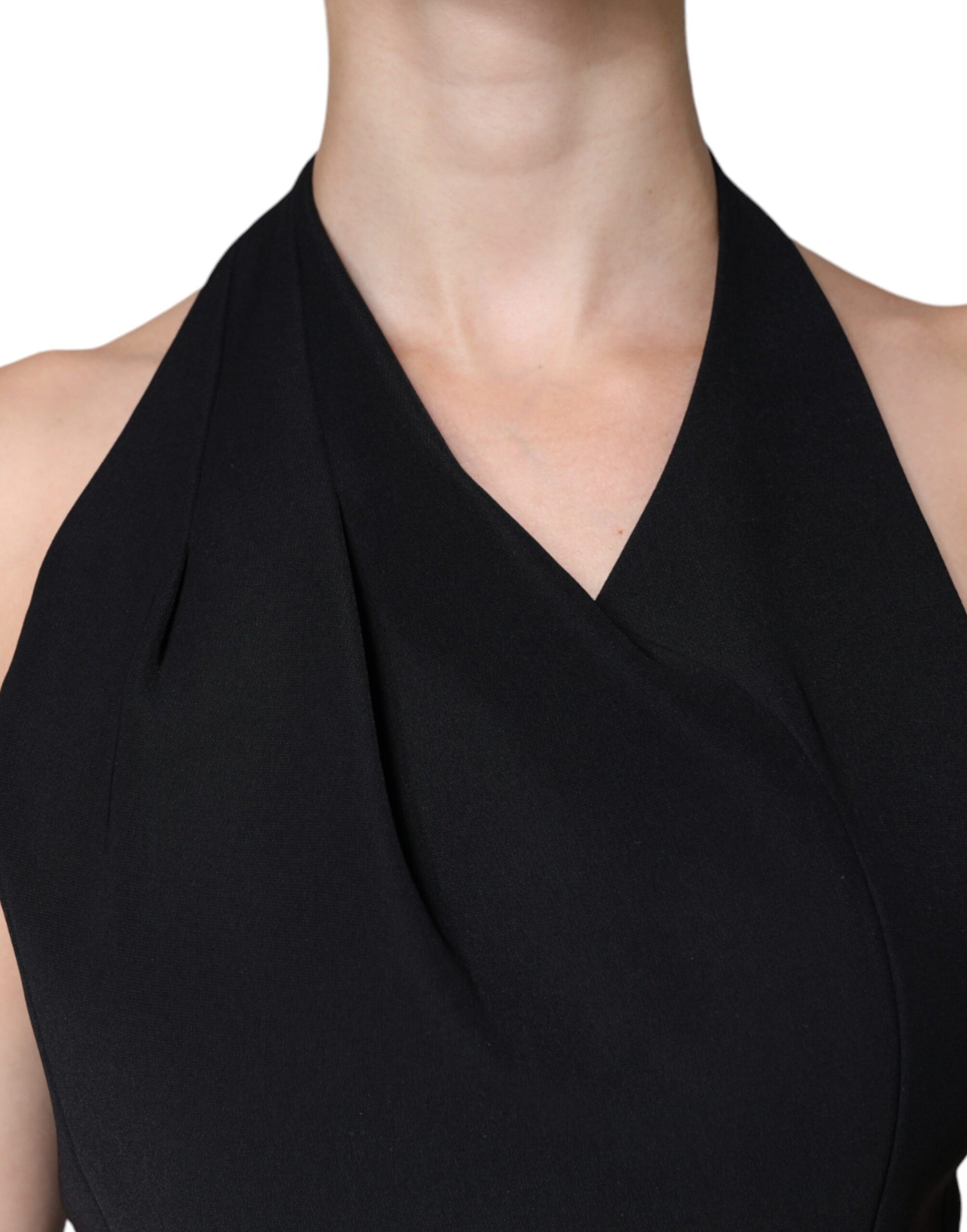 A black sleeveless halter sheath dress with a V-neckline