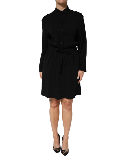 A black dress with a belt, featuring a viscose blend fabric