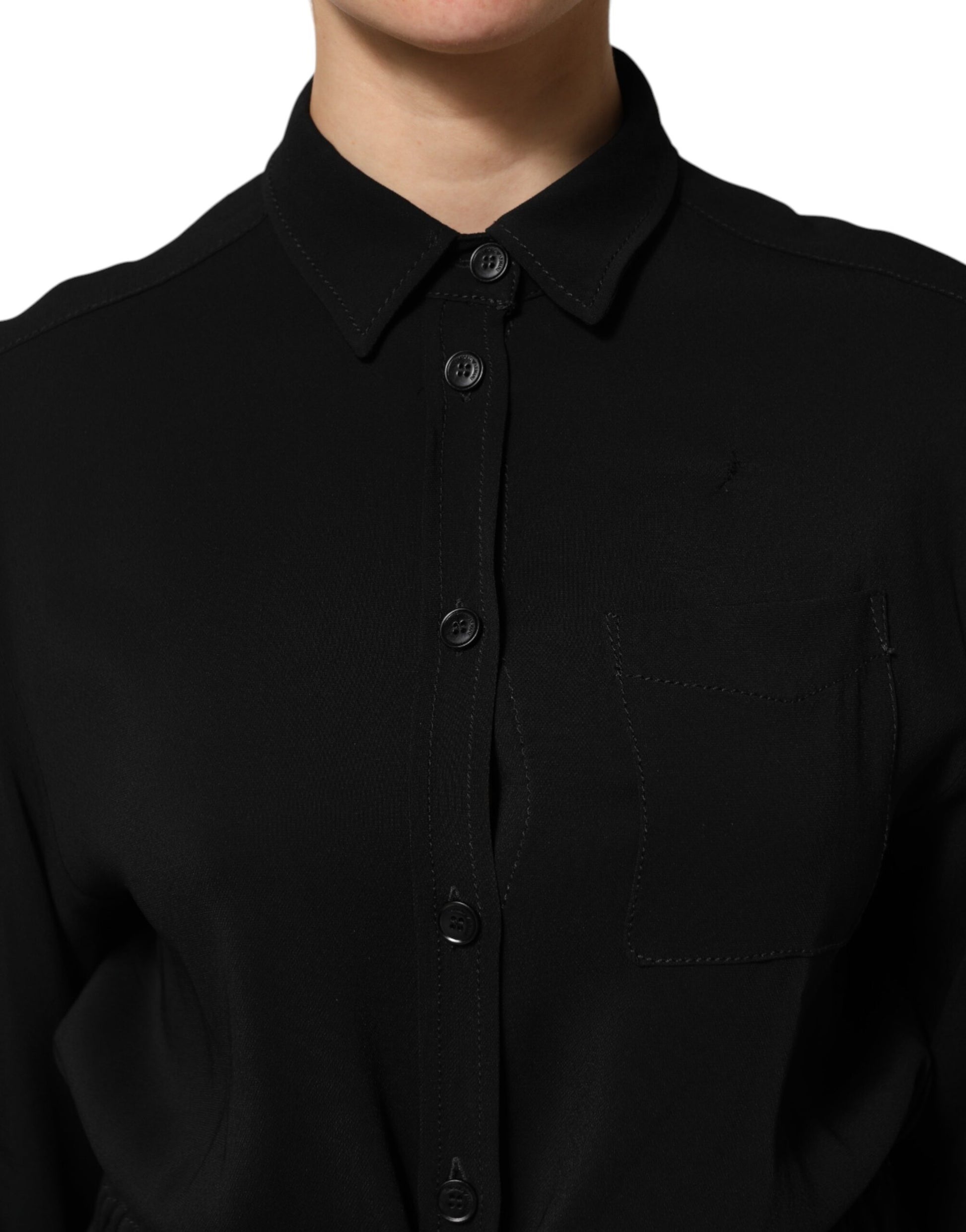A black viscose blend shirt style belted dress with a V-neckline