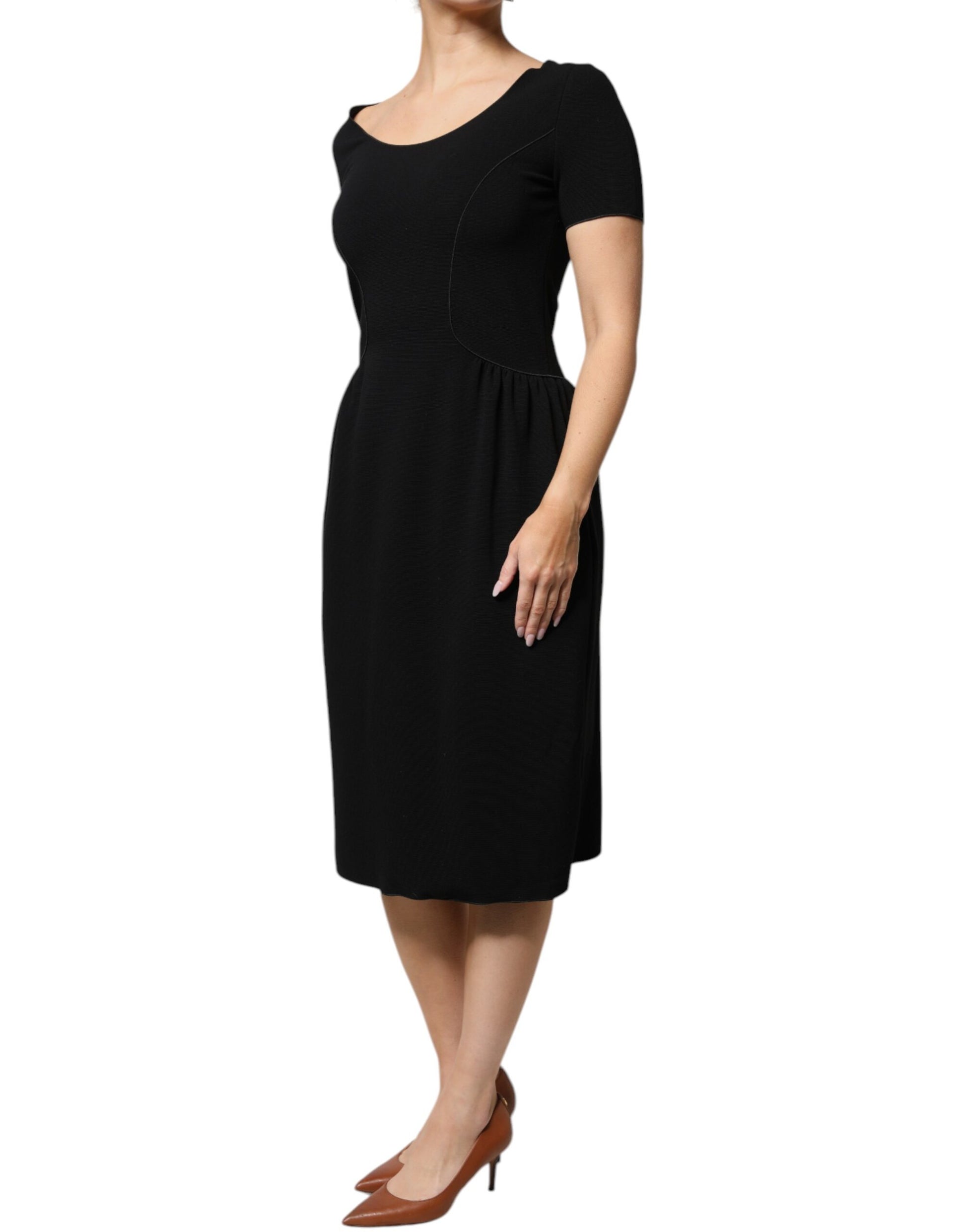 A black midi dress with short sleeves and a sheath silhouette