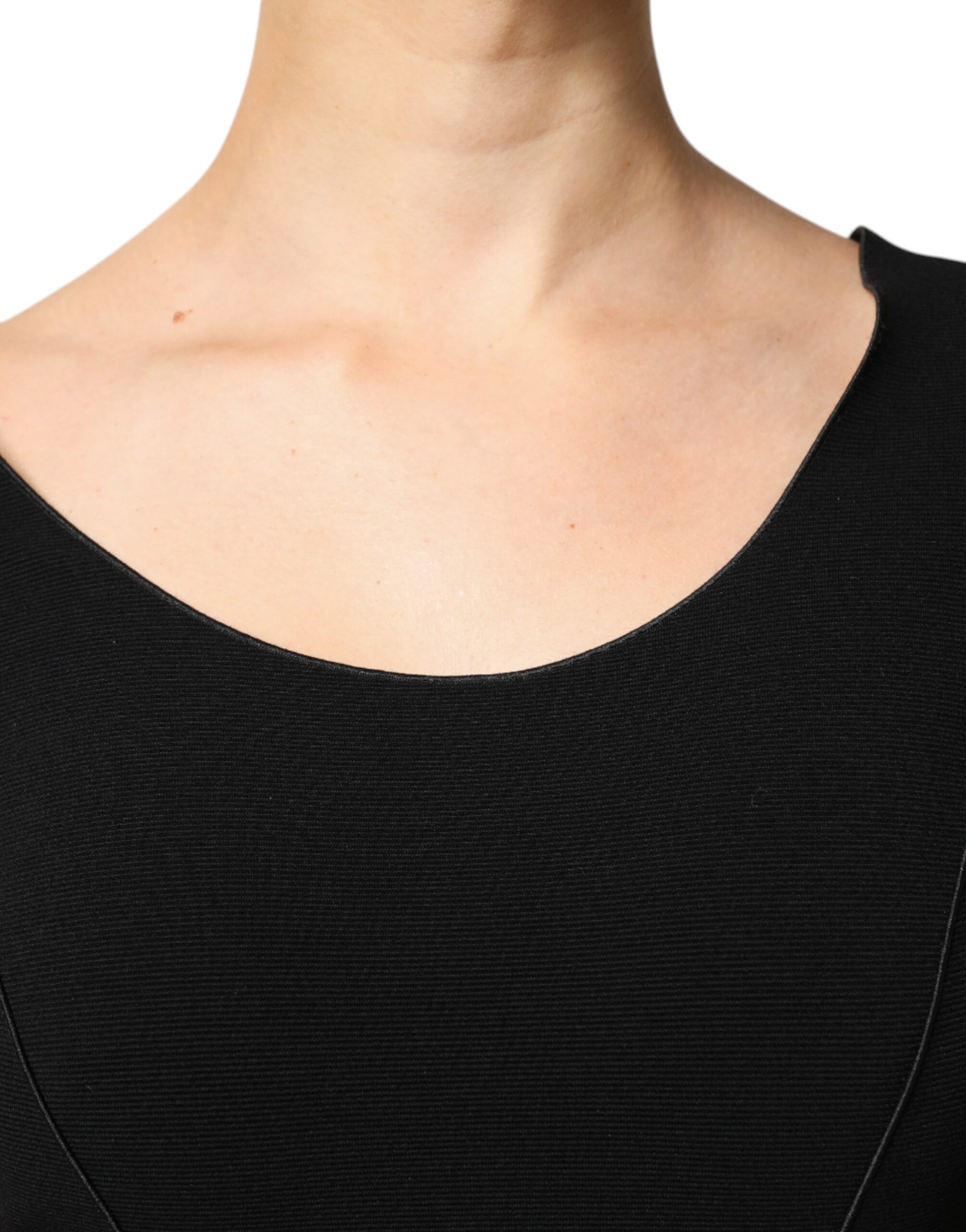 A black viscose midi dress with short sleeves and a sheath silhouette