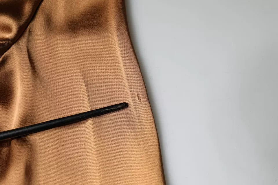A brown satin long sleeve wrap sheath mini dress with a black zipper