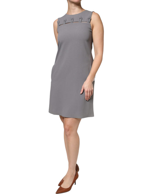 A gray sleeveless dress with a round neckline and an A-line silhouette. It is a mini dress, suitable for casu