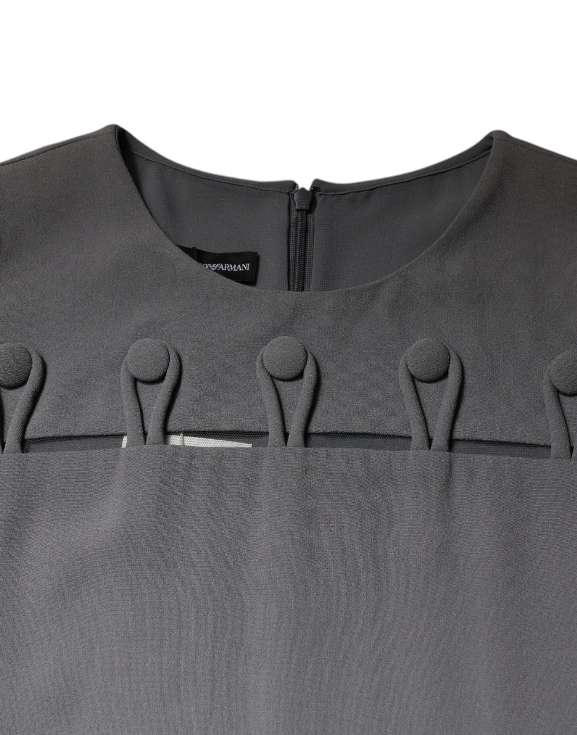 A gray sleeveless dress with a round neck and a zigzag pattern along the front. It appears to be an A-line st