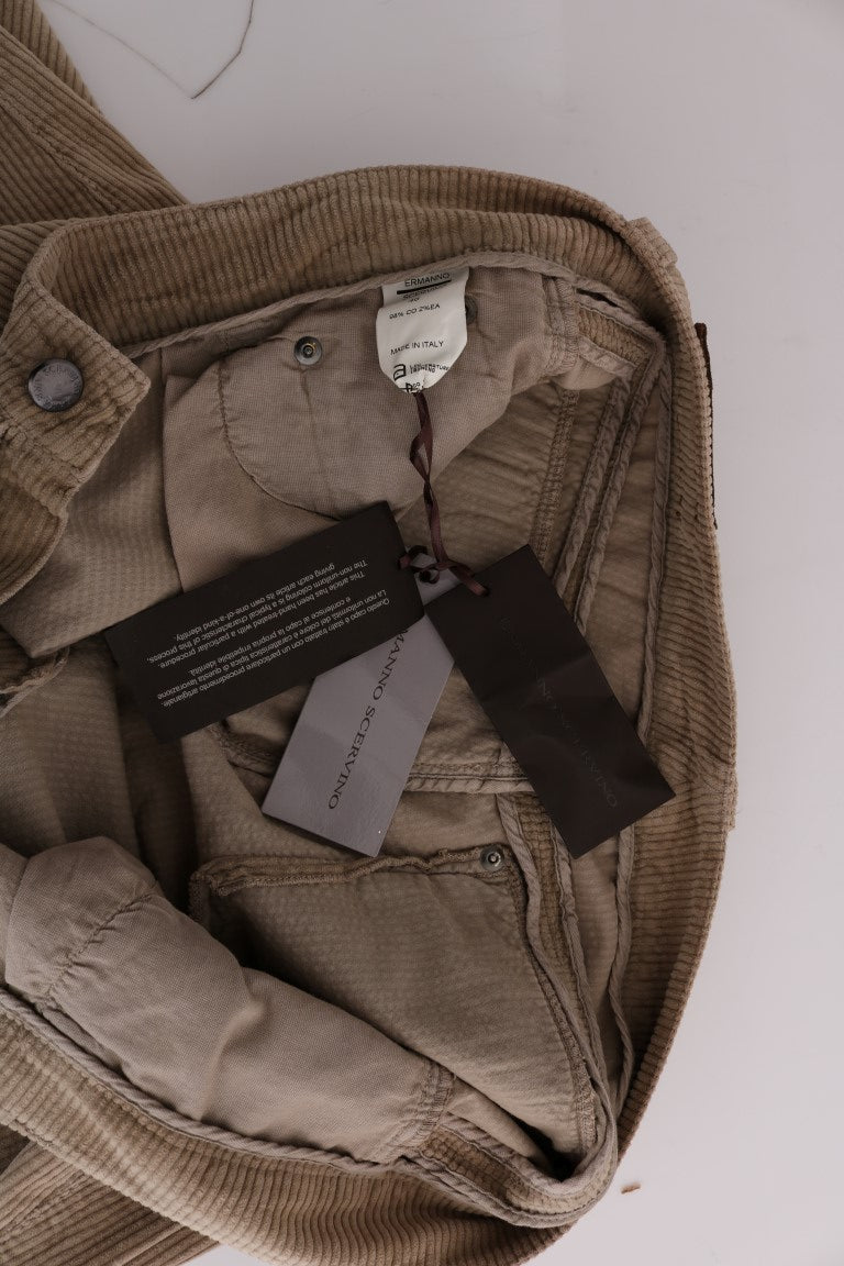 Pair of light brown jeans with tags attached to waistband