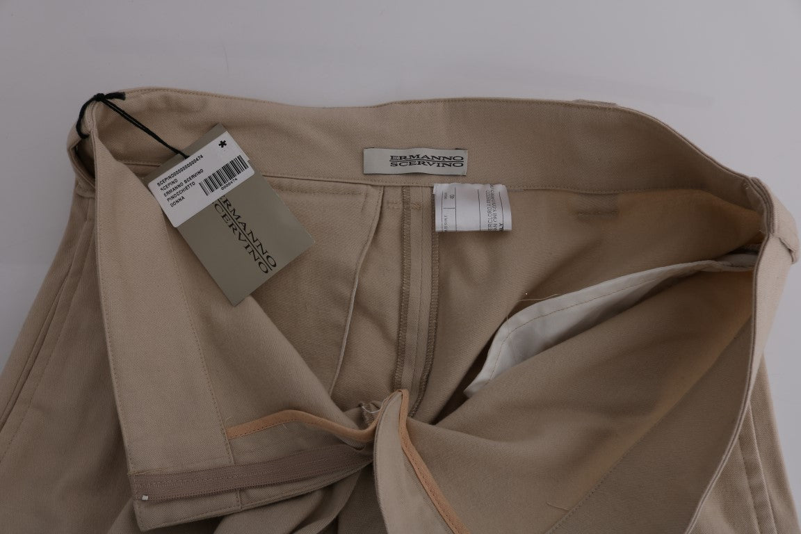 Tan pants on a hanger with tags
