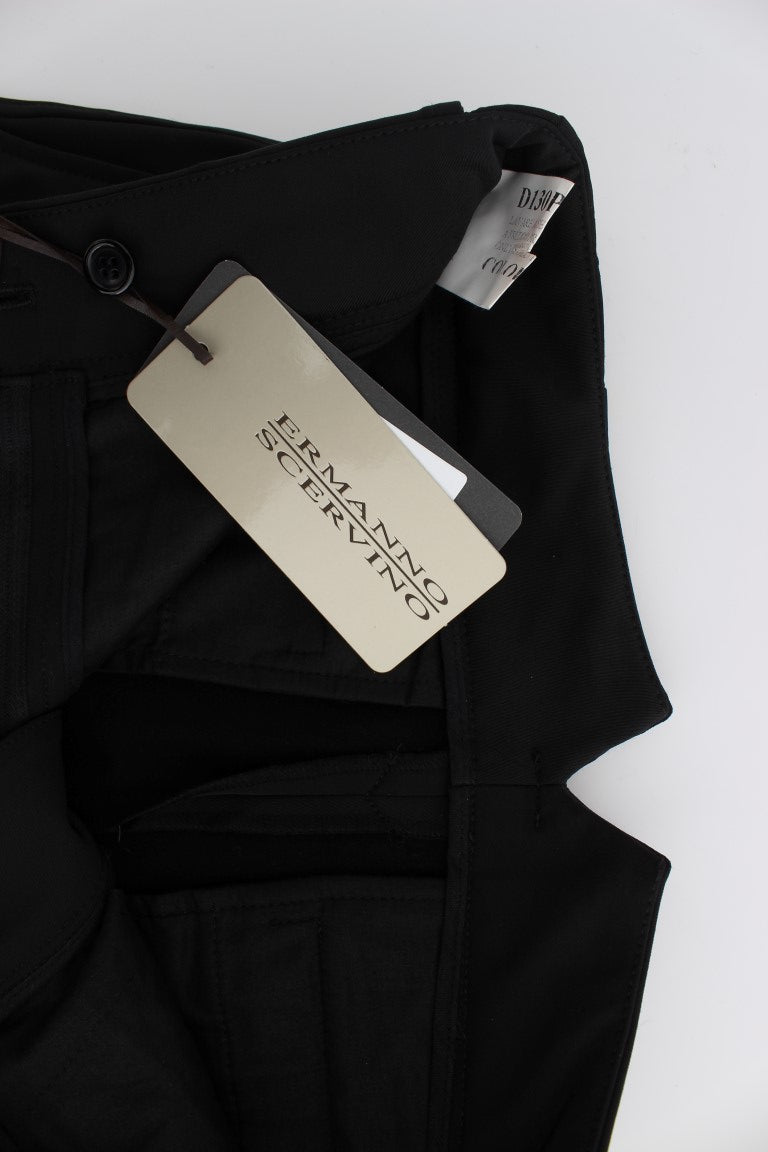 Black pants on a hanger with a tag