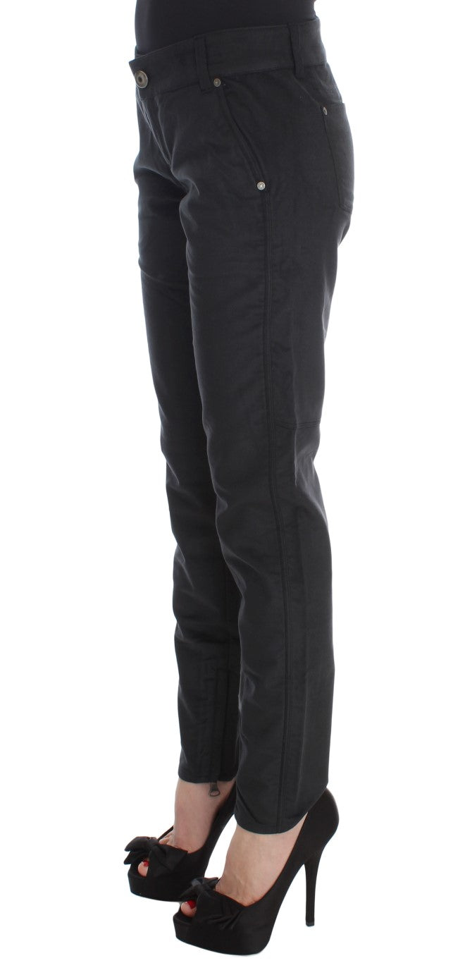Pair of black skinny jeans with zipper details on legs