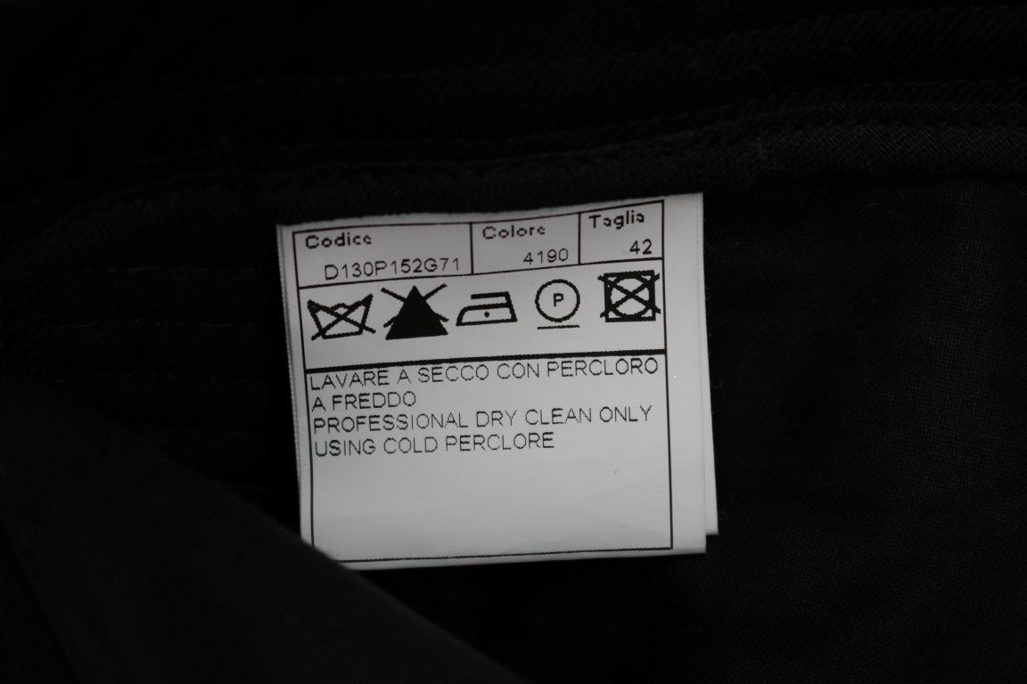 White tag on black fabric with instructions for washing