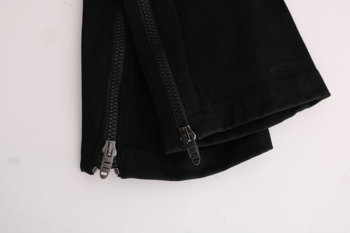 Stack of black leggings with zippers on sides