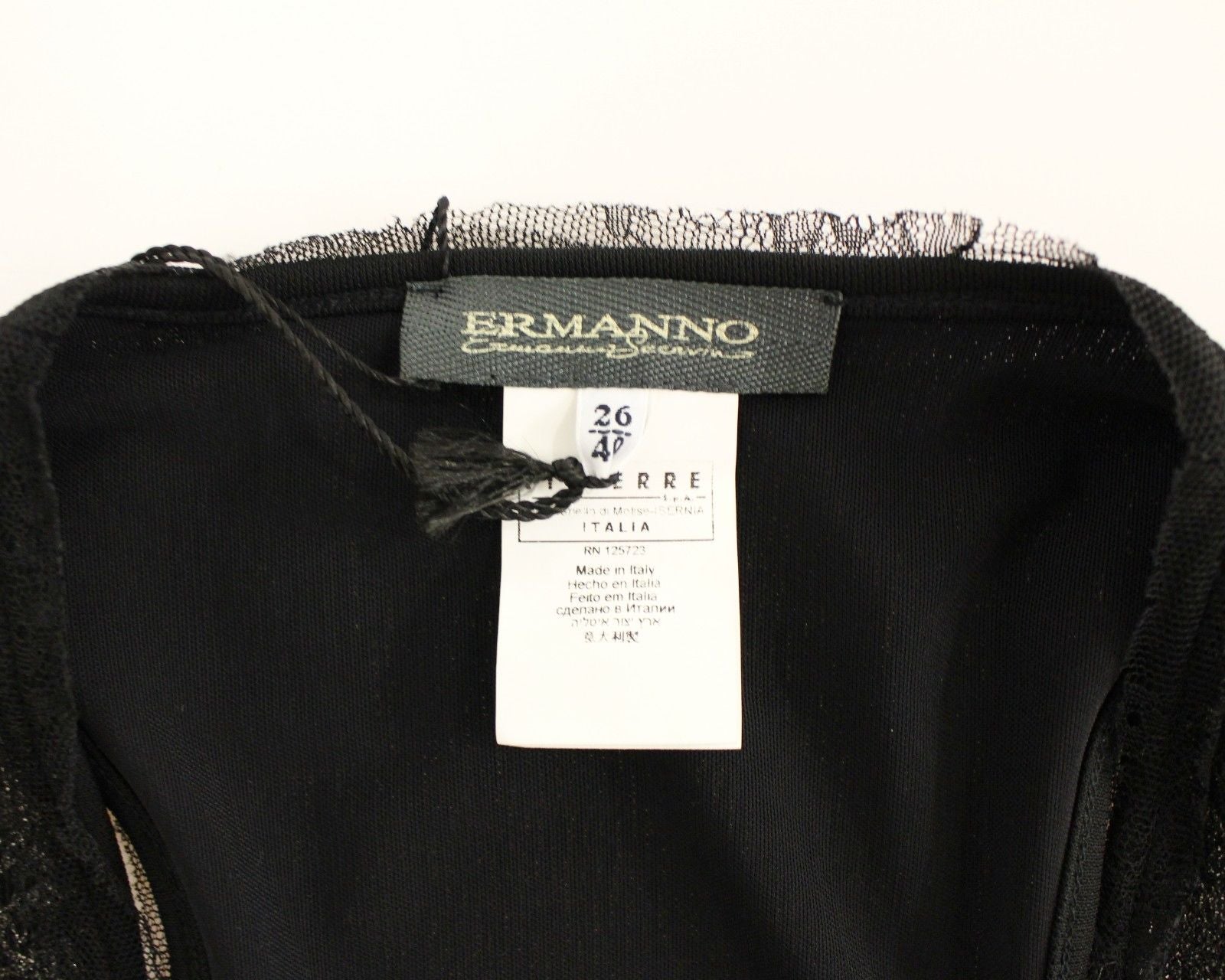 Black garment on hanger with tag