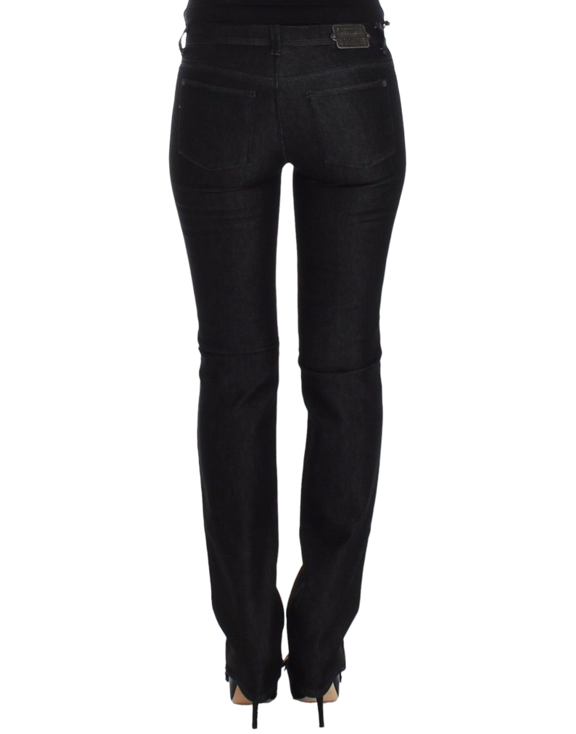 Pair of black skinny jeans with zipper detailing on legs