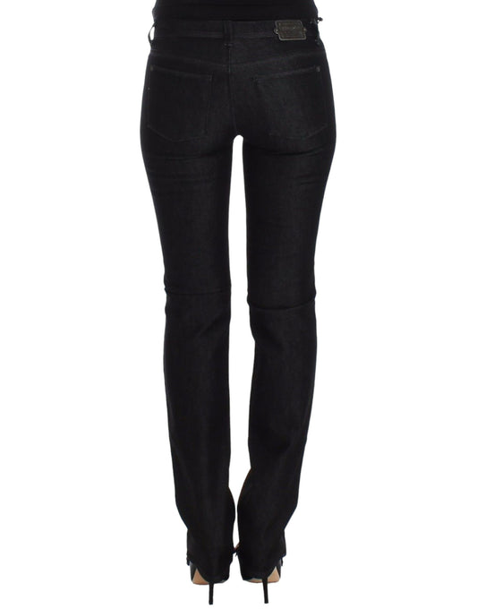Pair of black skinny jeans with zipper detailing on legs