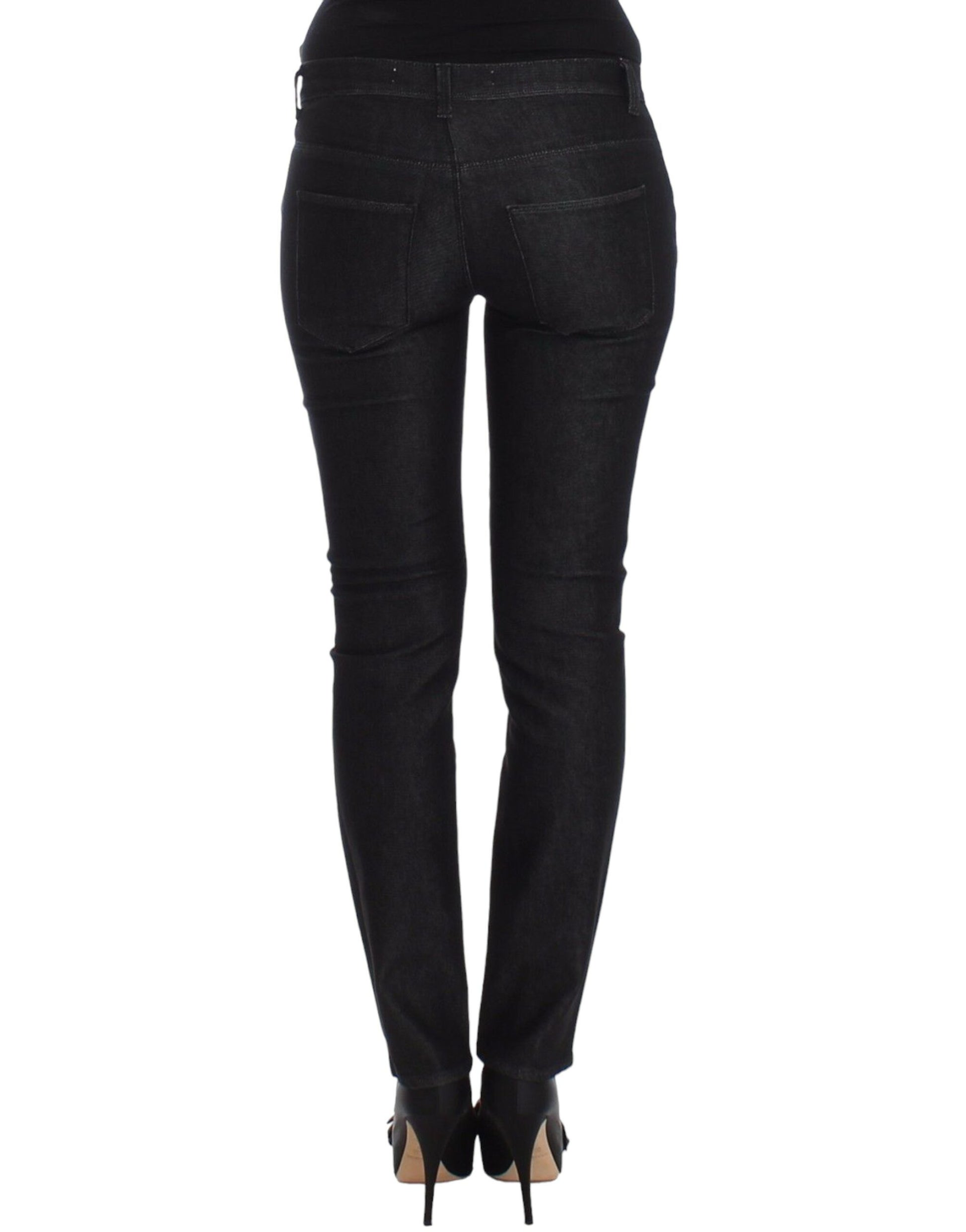 Pair of black skinny jeans with zipper details on legs