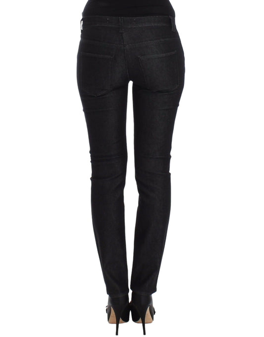 Pair of black skinny jeans with zipper details on legs