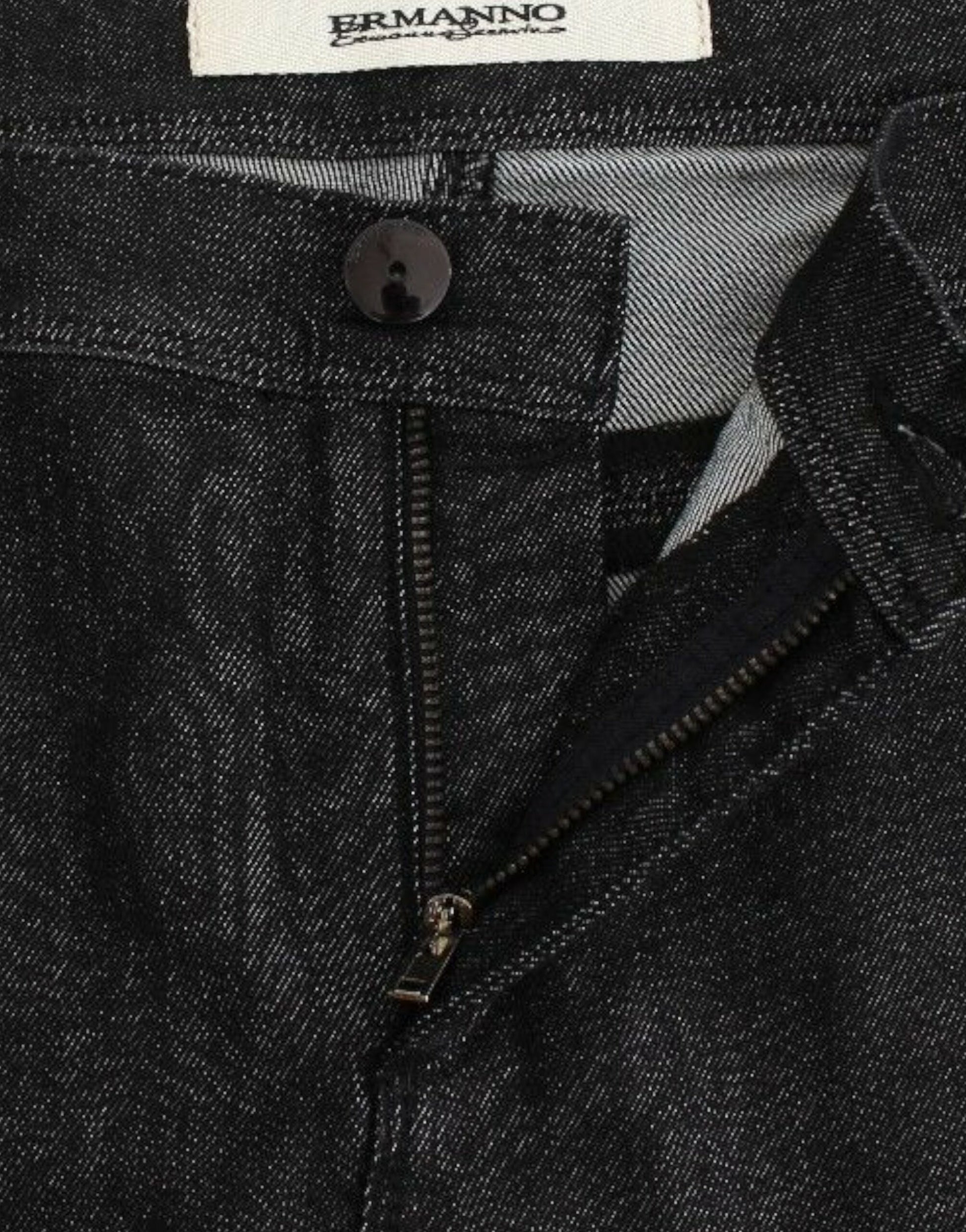 A pair of jeans with visible branding on the label and zipper details