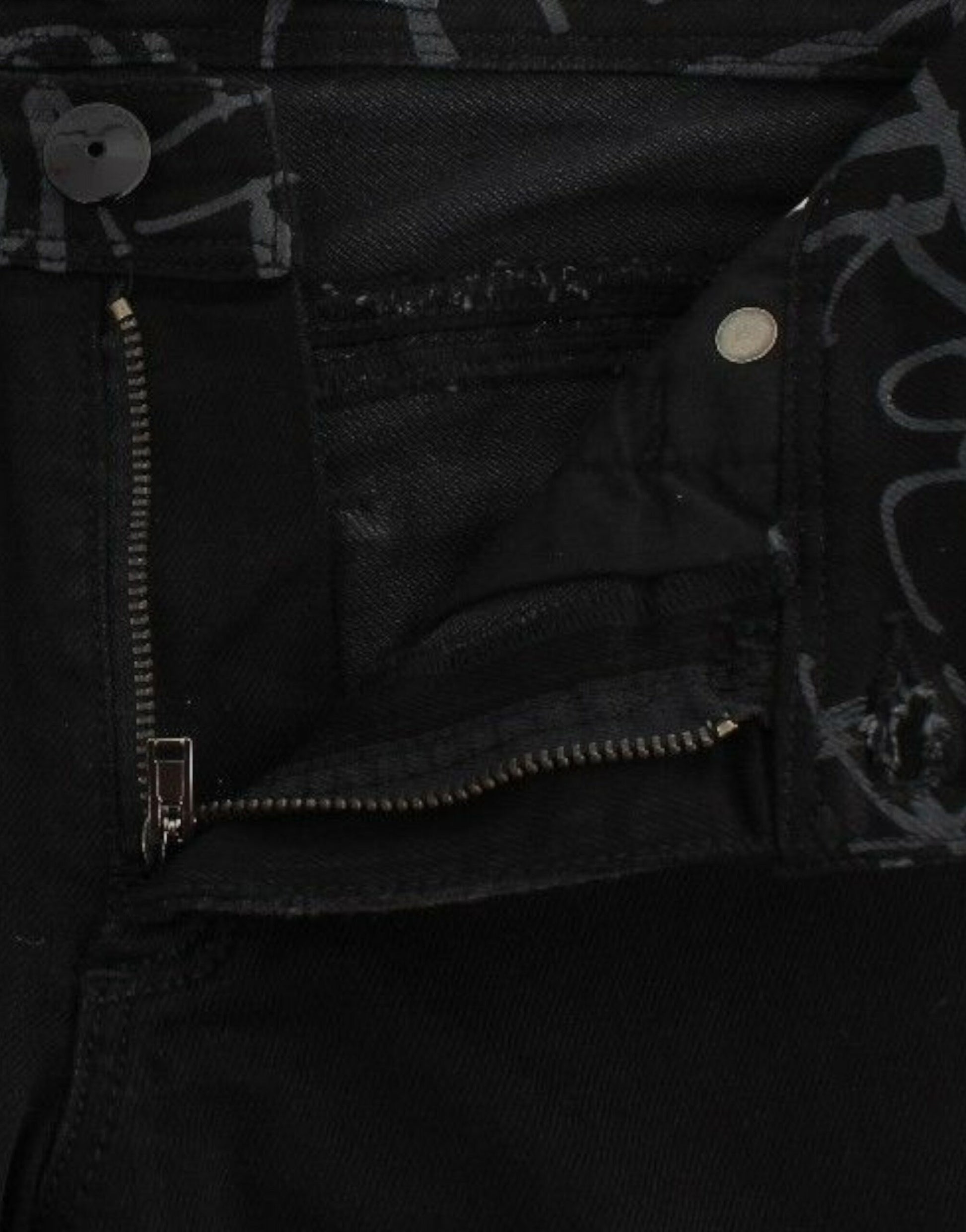 Pair of black jeans with zipper and button closure