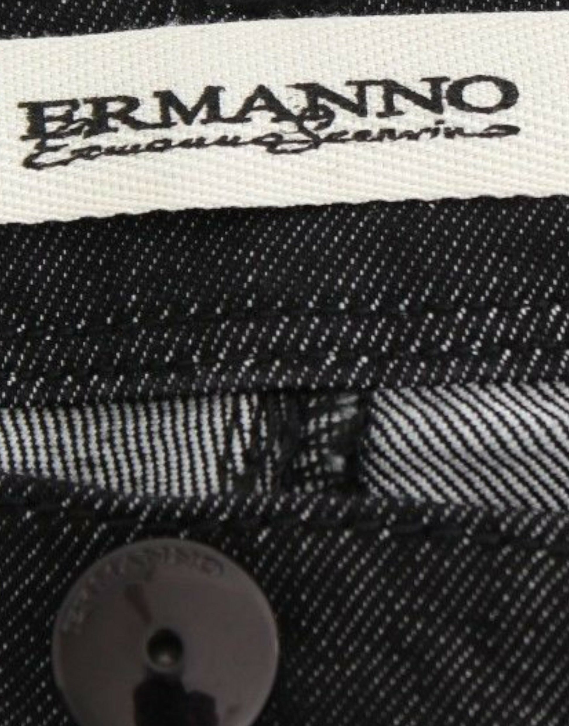 A label on a piece of clothing with the brand name ERMANNO visible