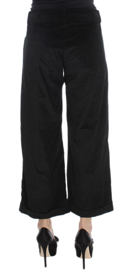 Black pants with flared legs and black heels