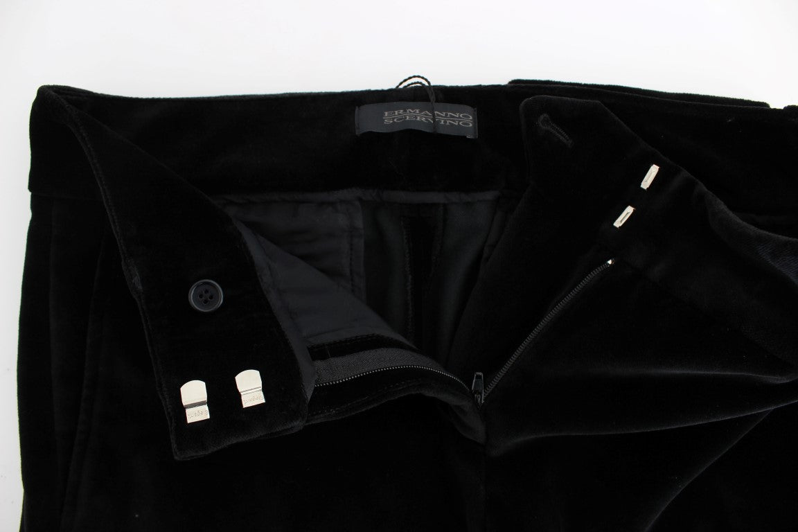 Pair of black velvet pants with buttons on front