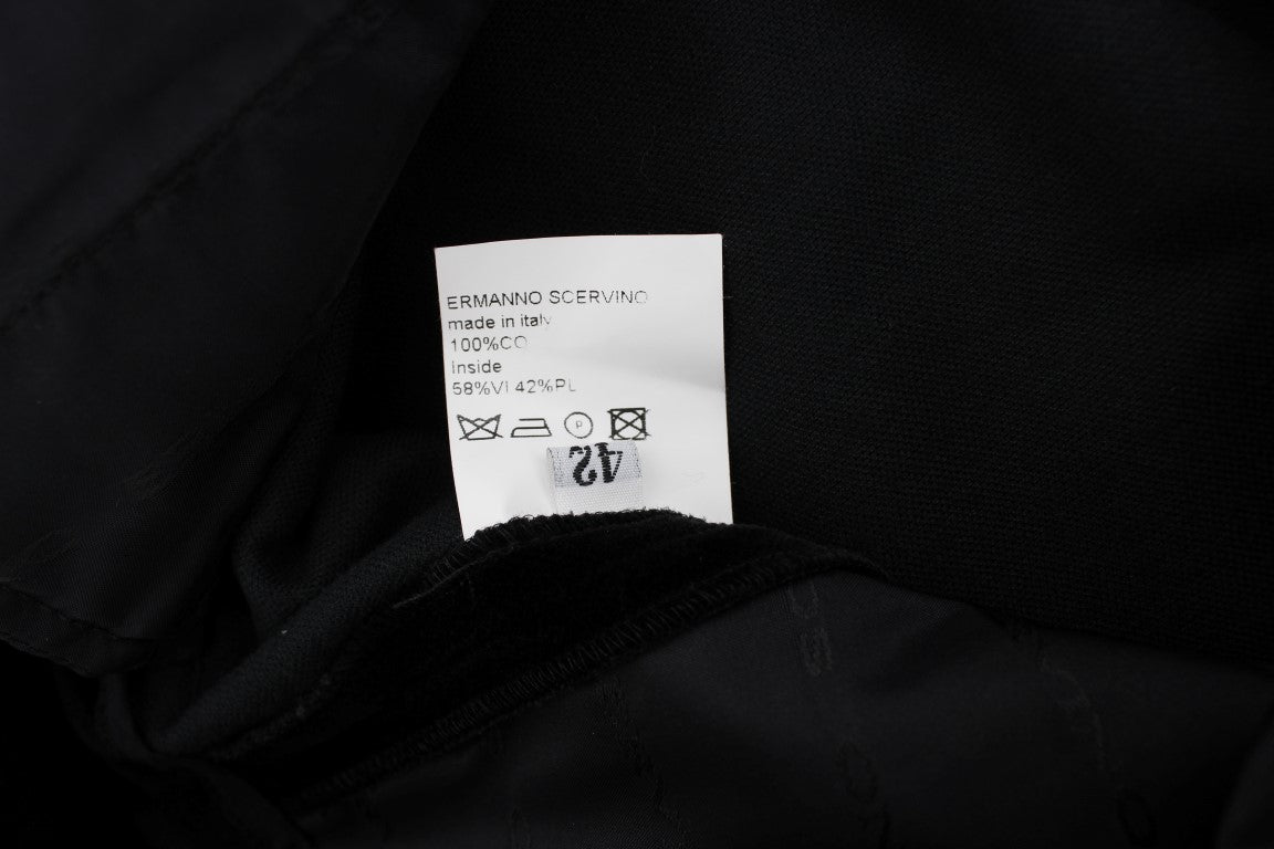 Black fabric with white tag attached to it