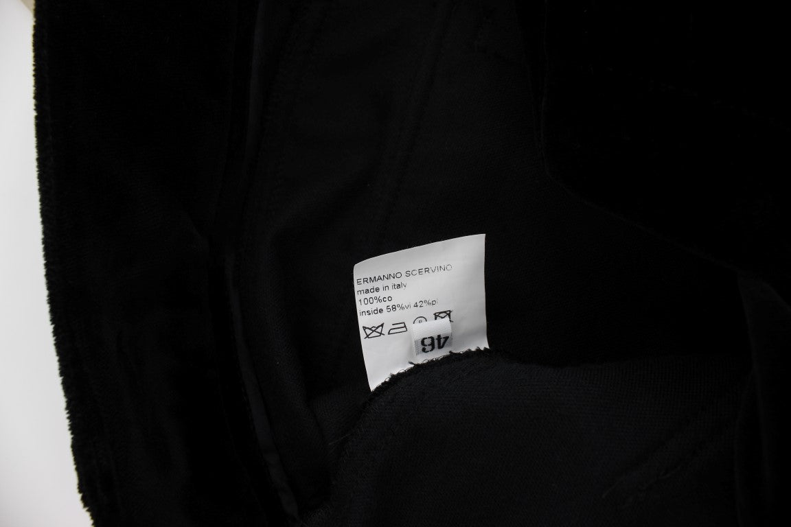 Black fabric with white tag attached to it