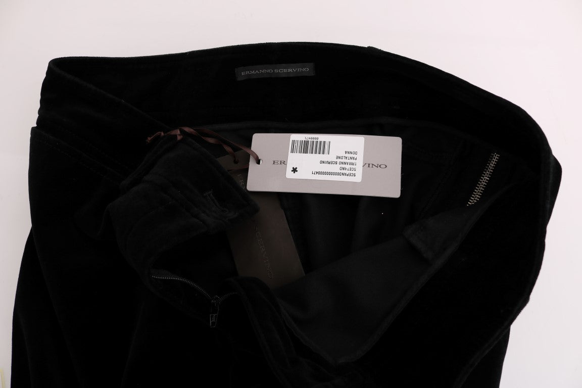 Black velvet pants on hanger