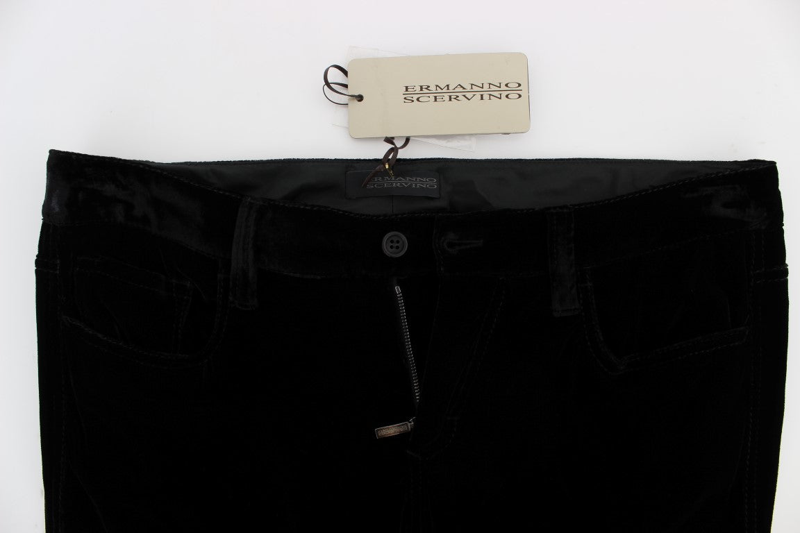 Black velvet pants on hanger