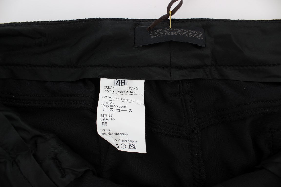 Black pants on a hanger with a tag