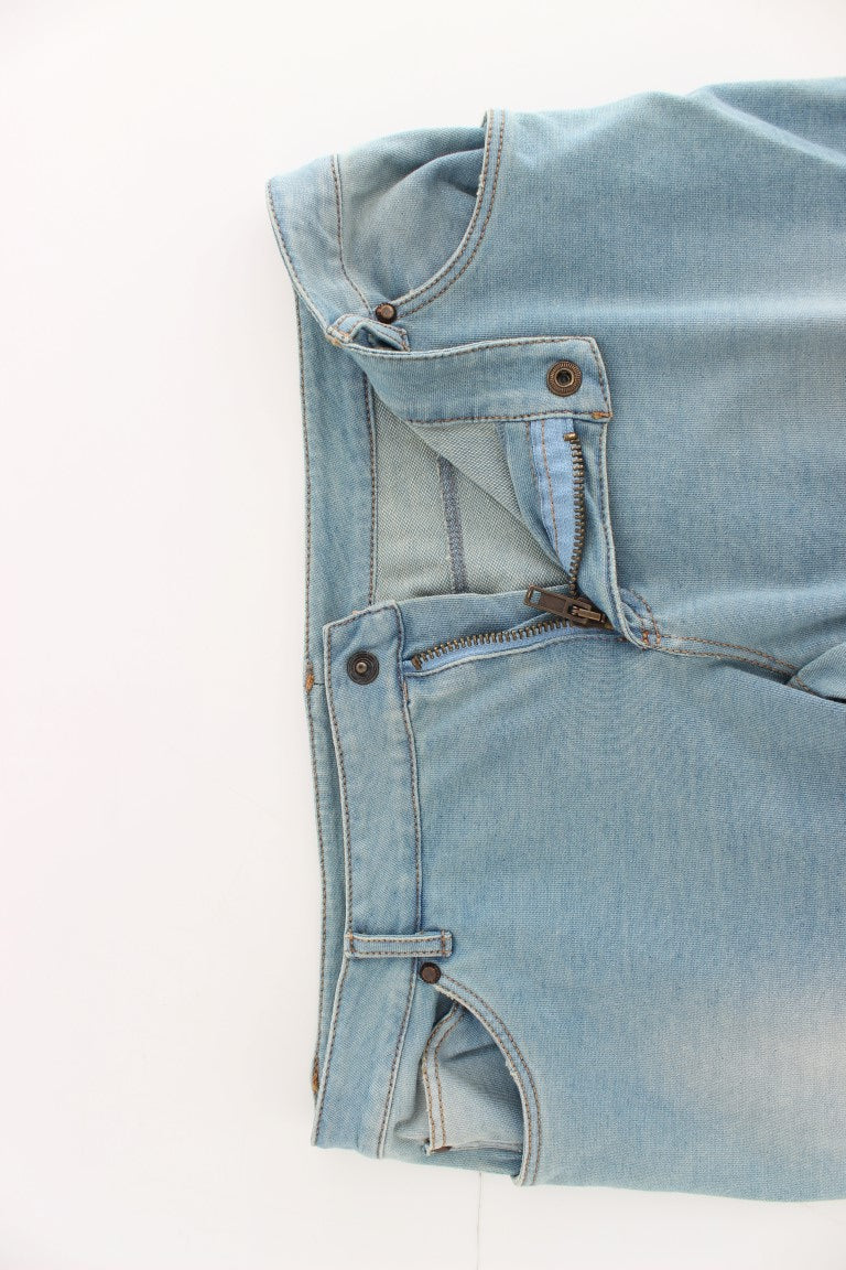 Blue denim jeans on white surface