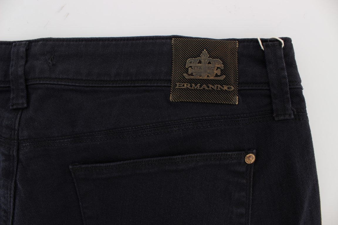 Pair of dark blue jeans with a brand logo on the waistband