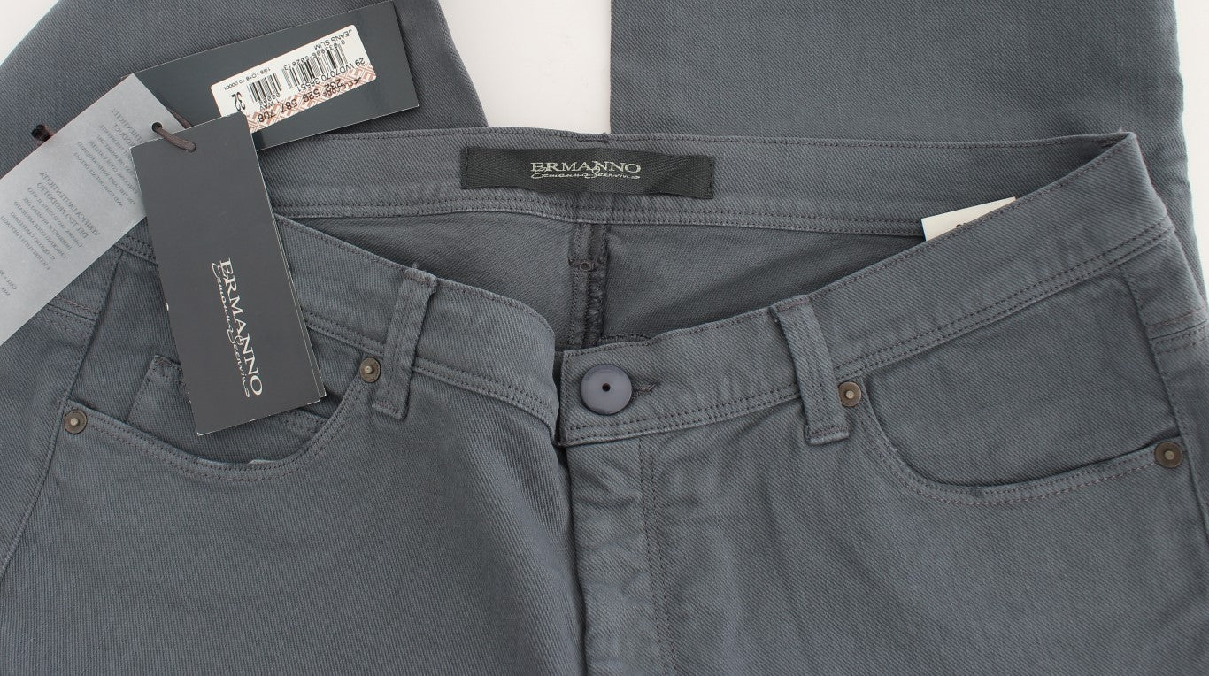 Pair of dark blue jeans on a hanger