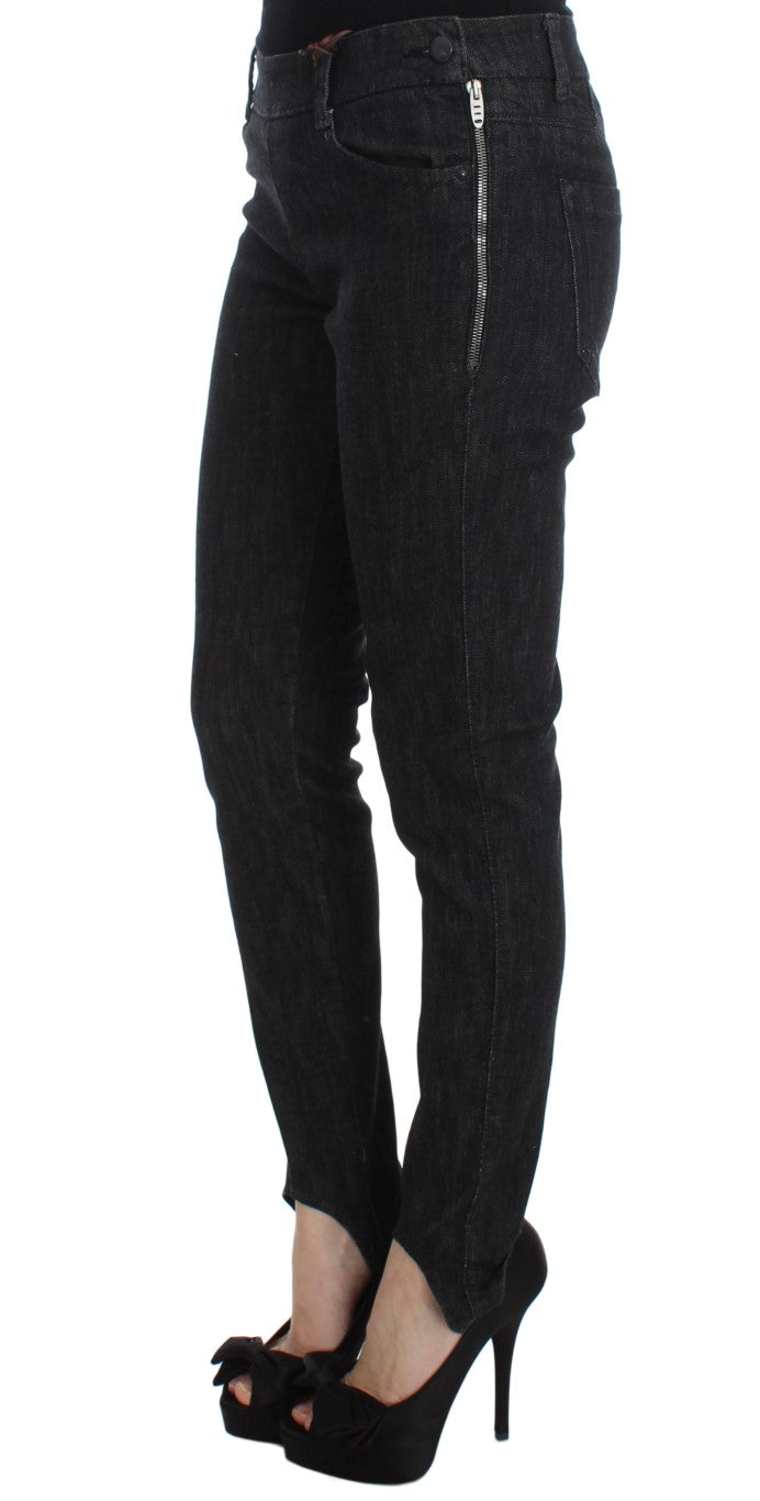 Pair of black skinny jeans with zipper detailing on legs