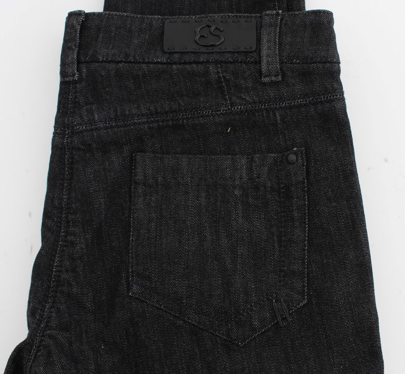 Pair of dark blue denim jeans with visible brand label on waistband
