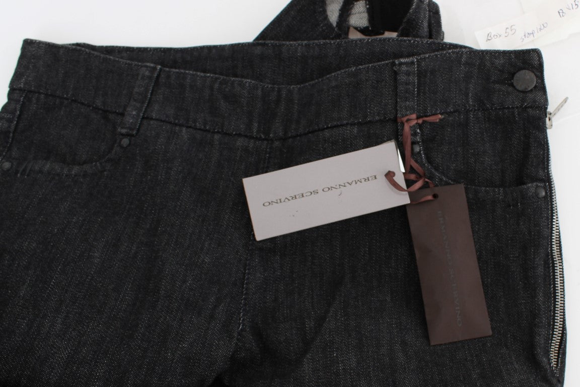 Pair of dark denim jeans with tag attached to waistband