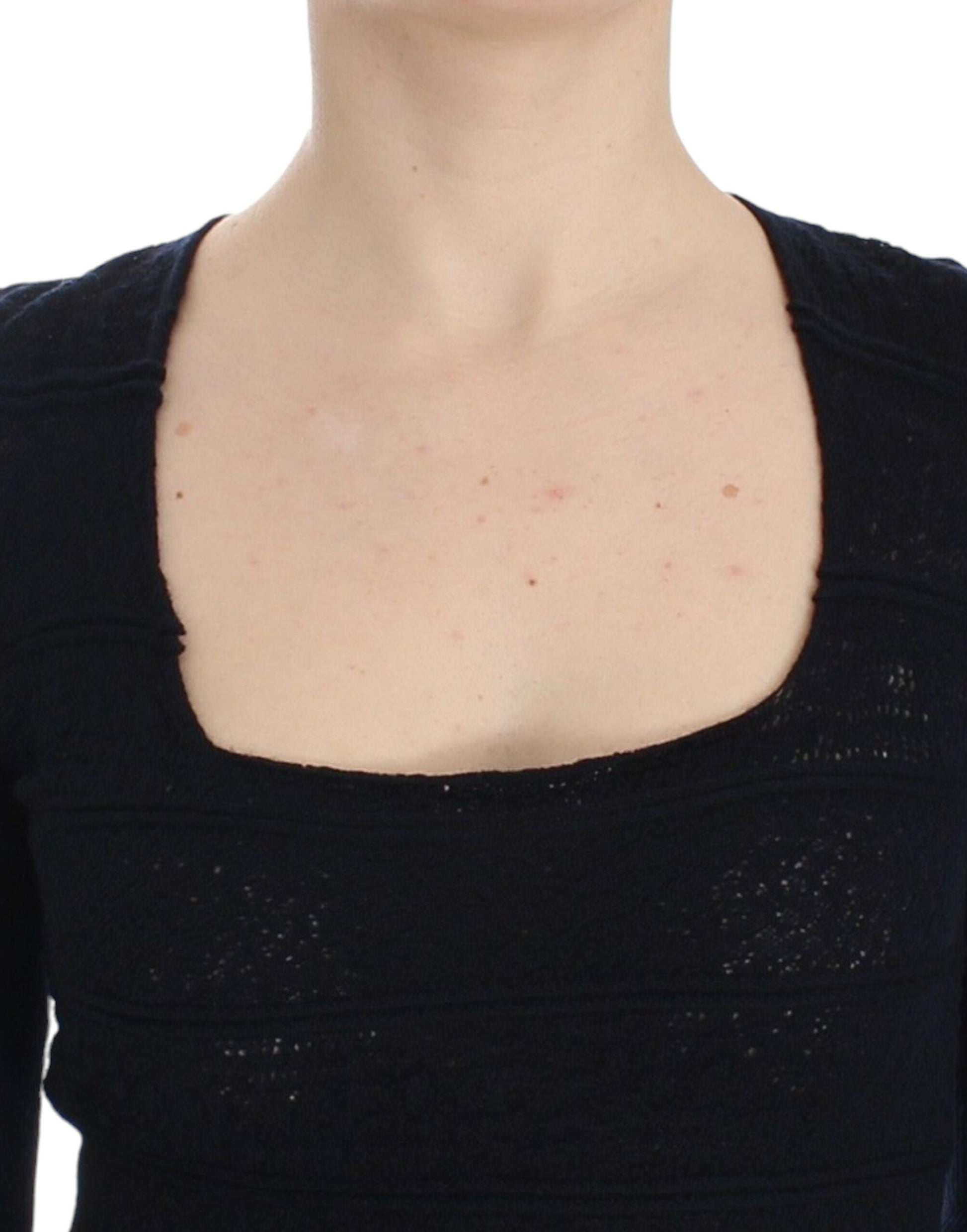 Woman wearing black top with scoop neckline