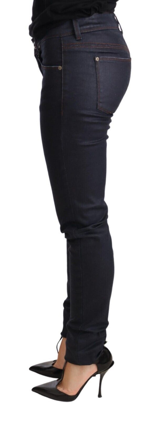 Woman wearing blue jeans and black heels