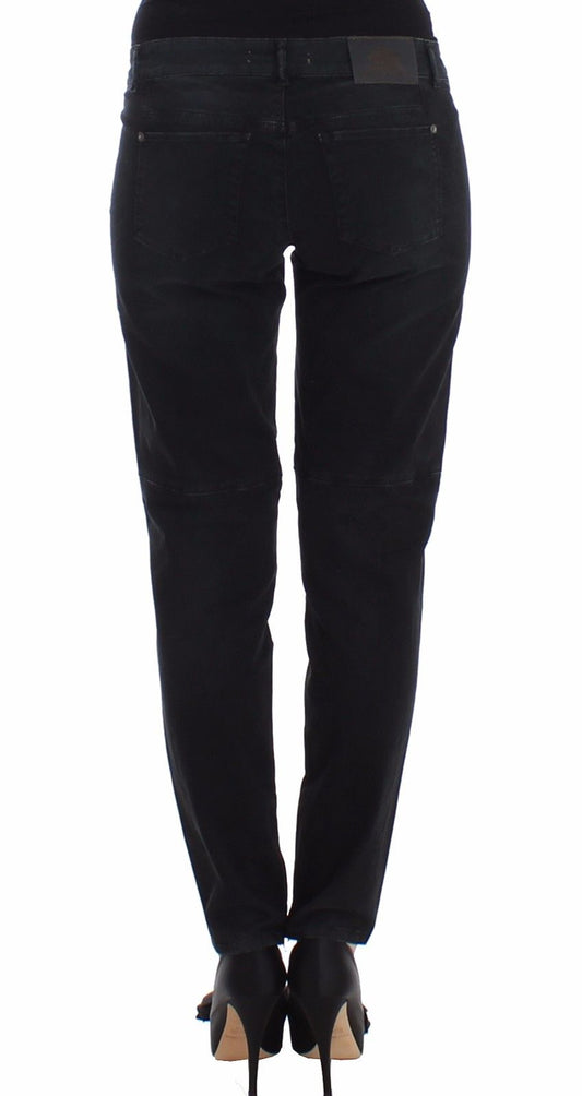 Pair of black pants with a faded wash effect and distressed areas