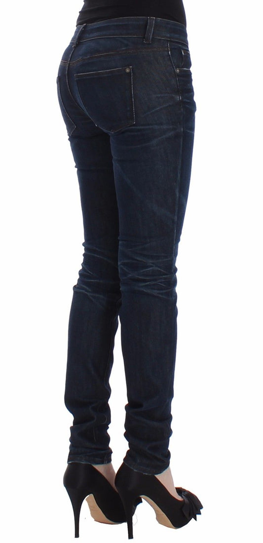 Woman wearing blue jeans and black high heels