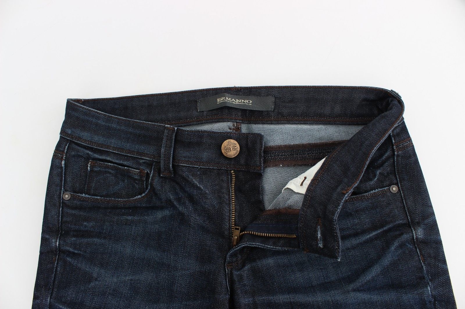 Pair of blue denim jeans with button closure and belt loops