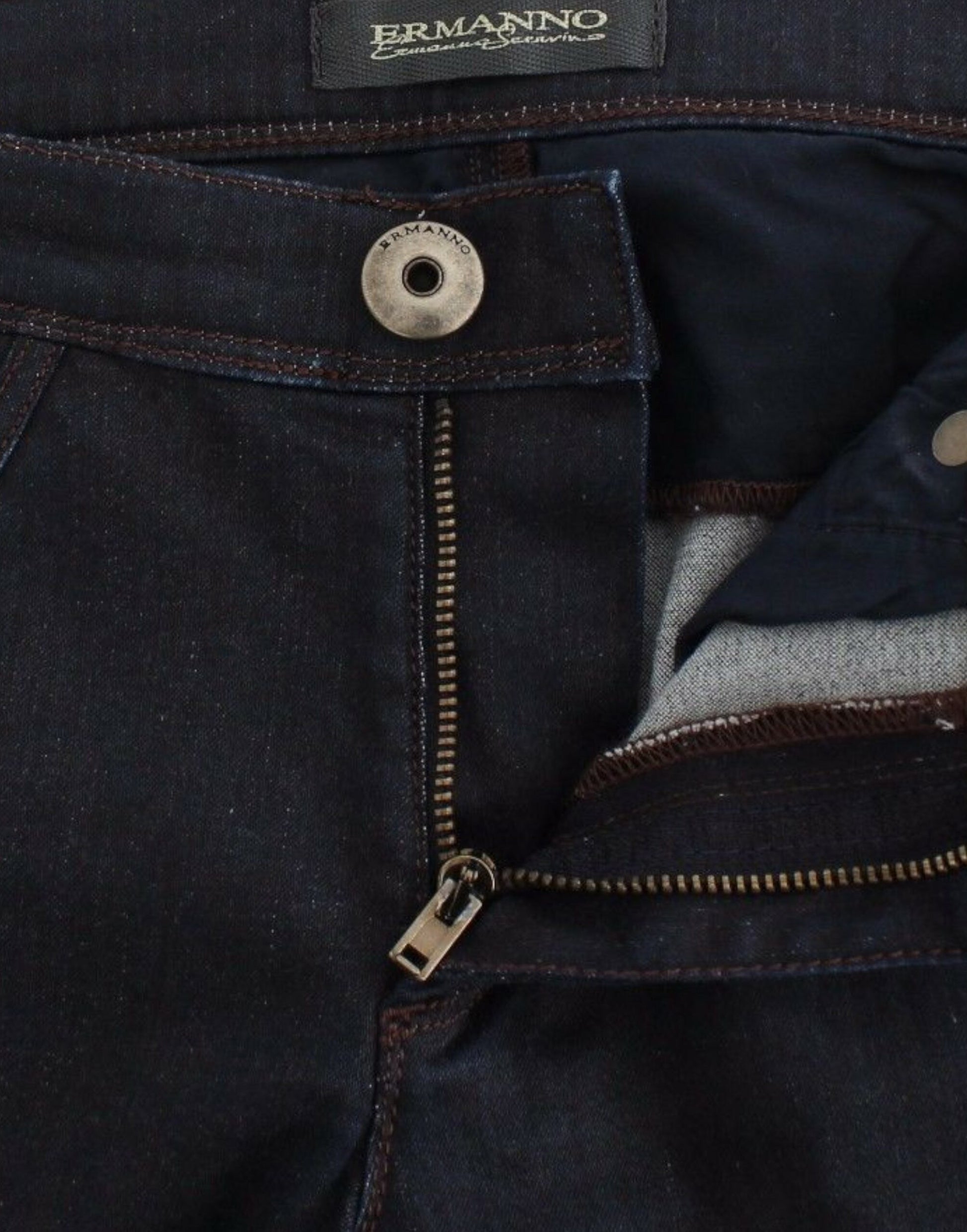 Pair of blue jeans with zipper and button closure