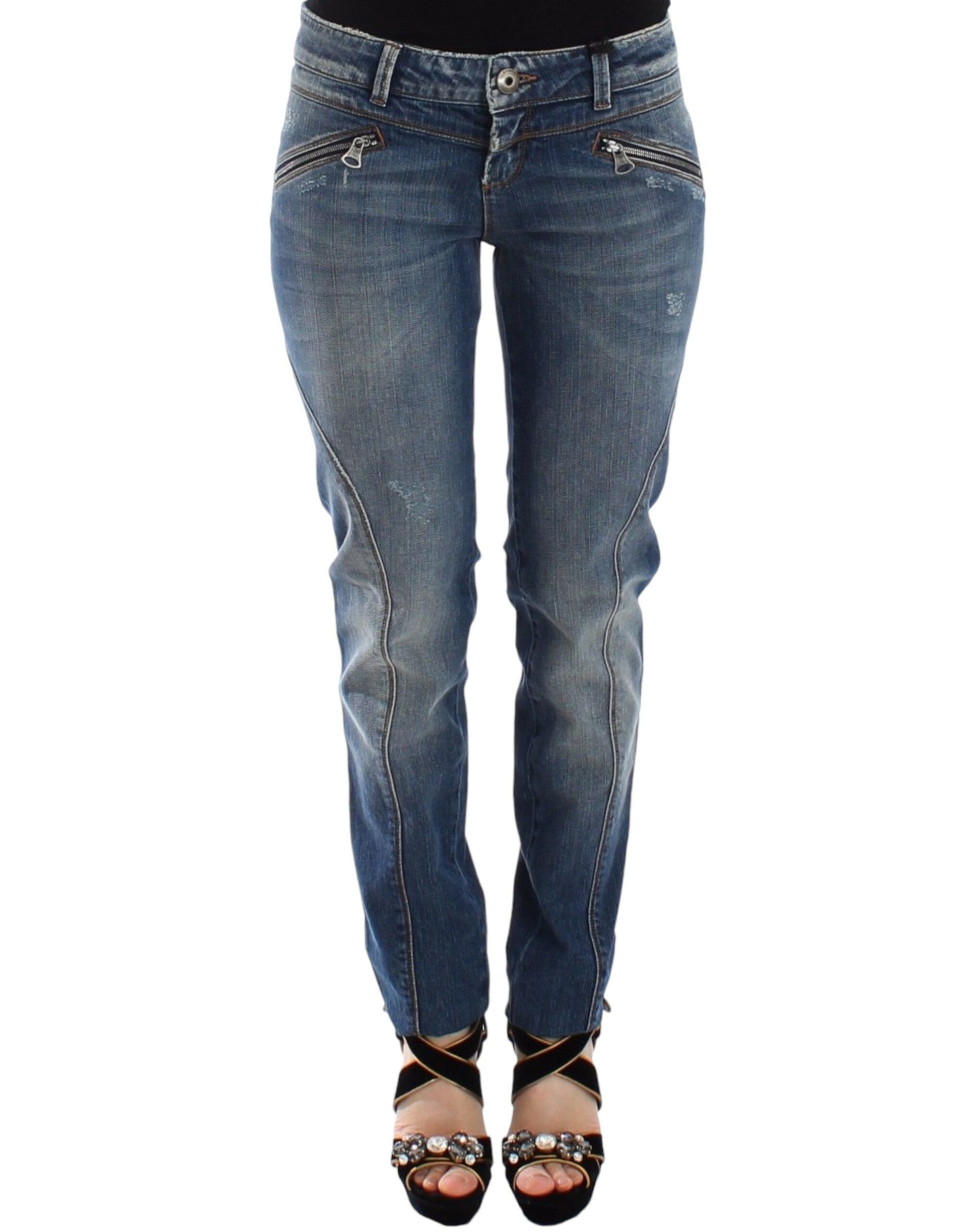 Pair of women's jeans with faded wash and rips at knees