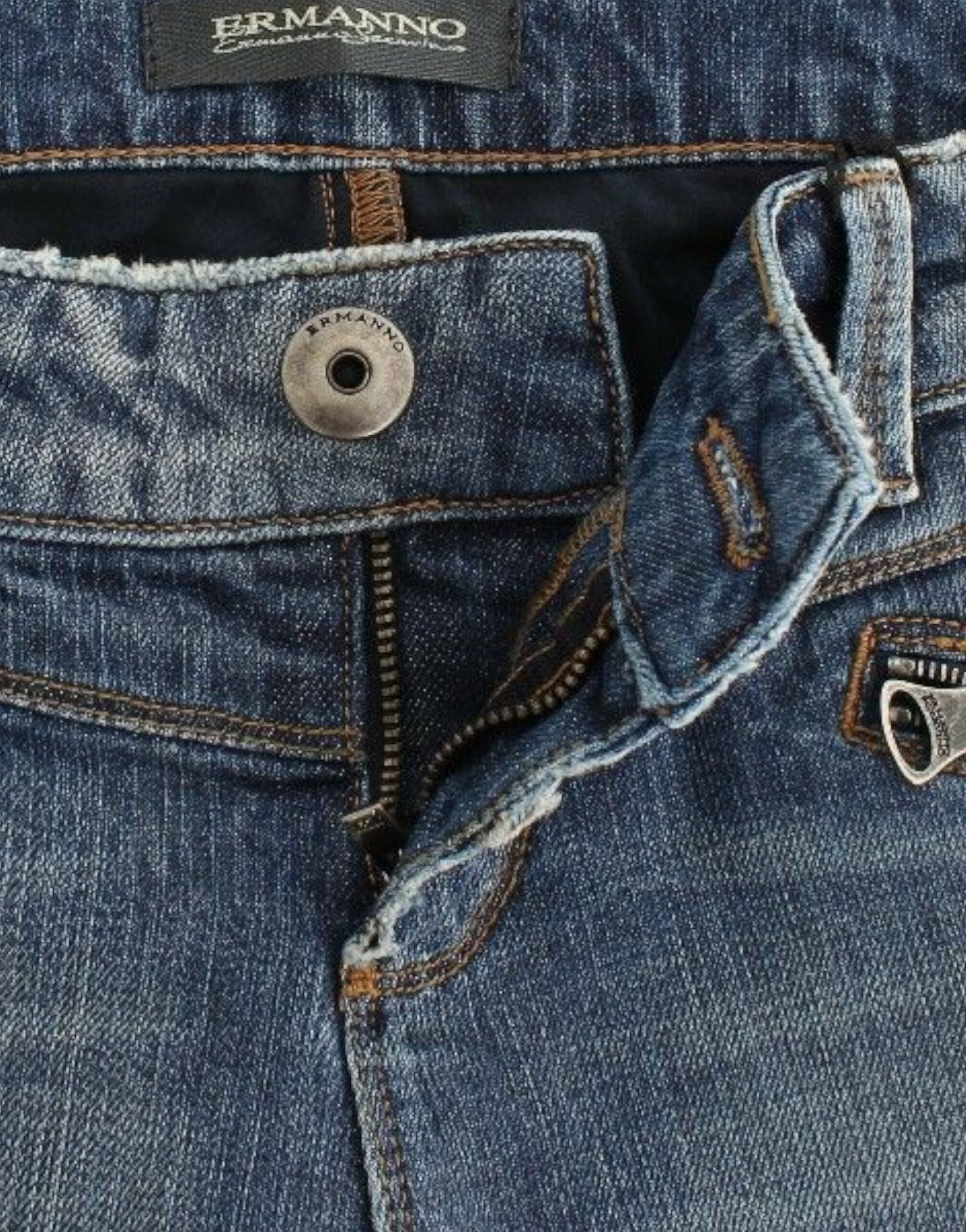 Pair of blue jeans with button and zipper fly
