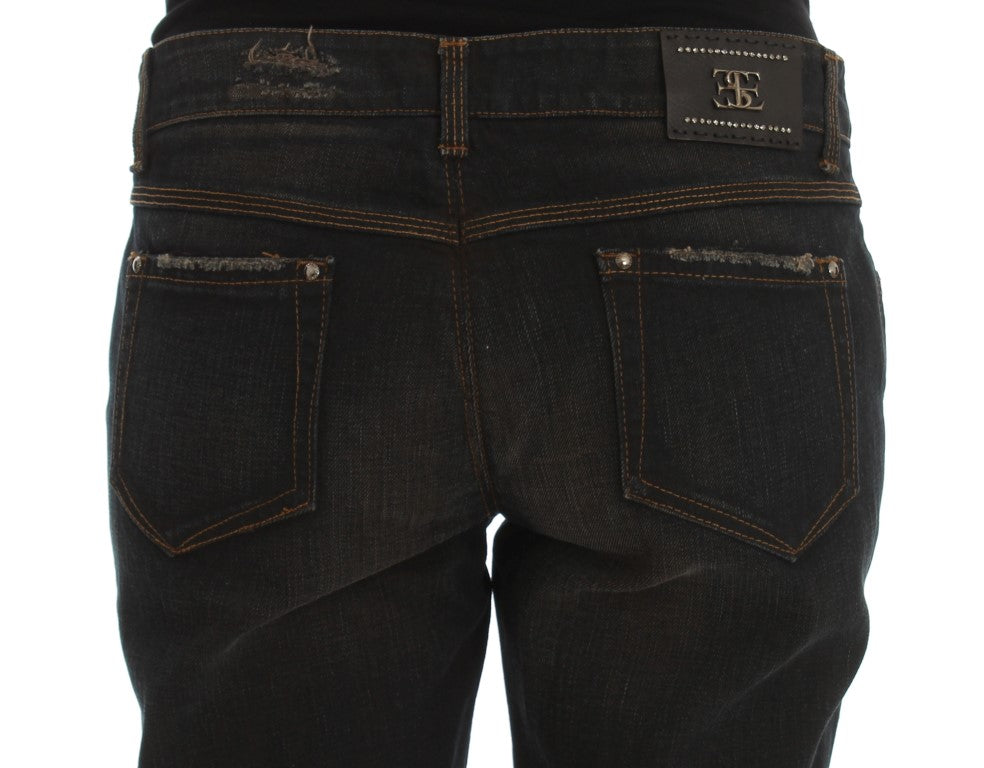 Pair of blue jeans with visible stitching and rivets on pockets