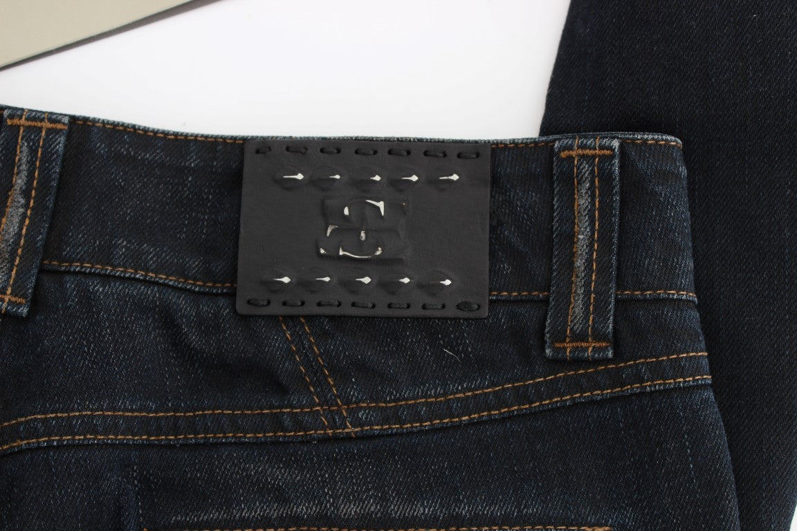 Pair of blue jeans with brown stitching on waistband and pockets