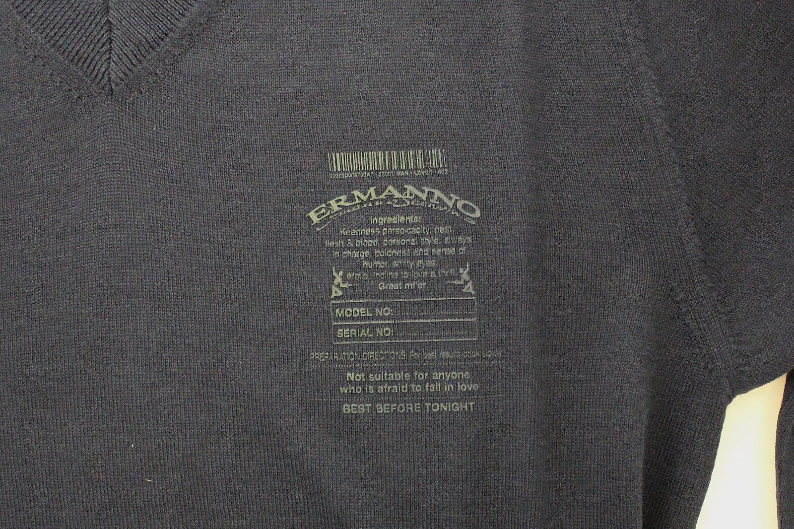 Black fabric with green embroidery on front
