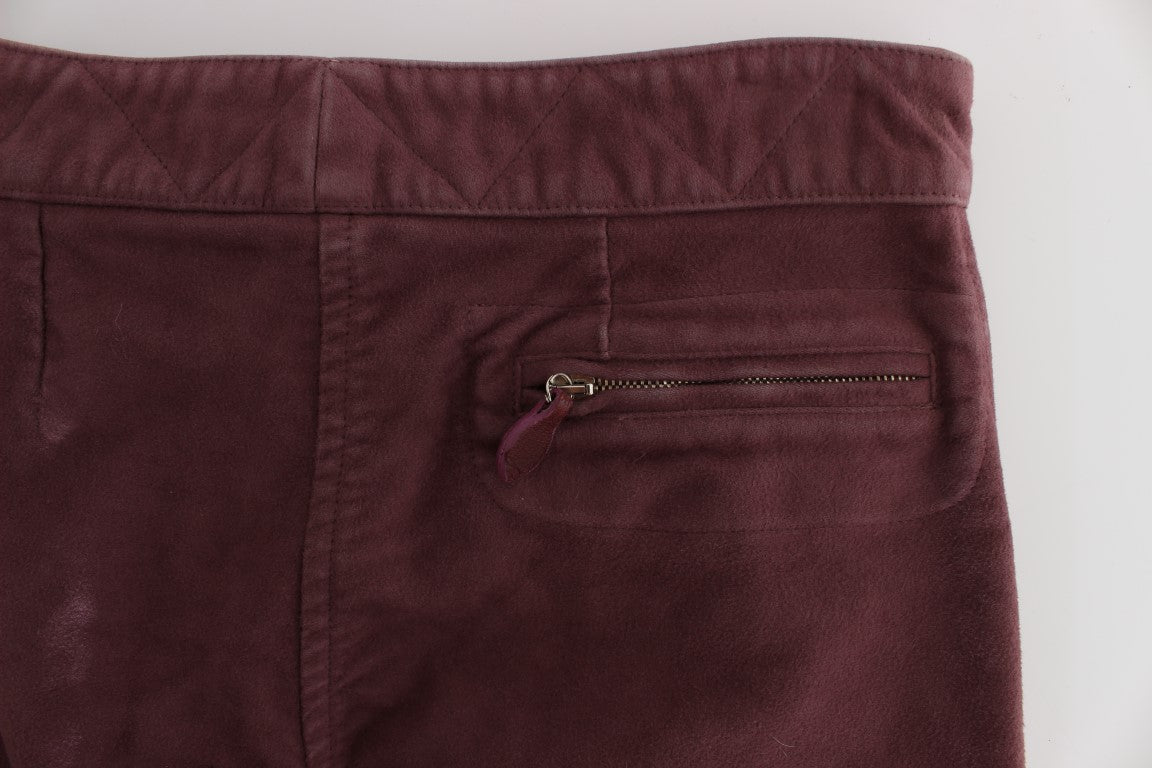 Pair of burgundy pants with zippered pocket on left leg