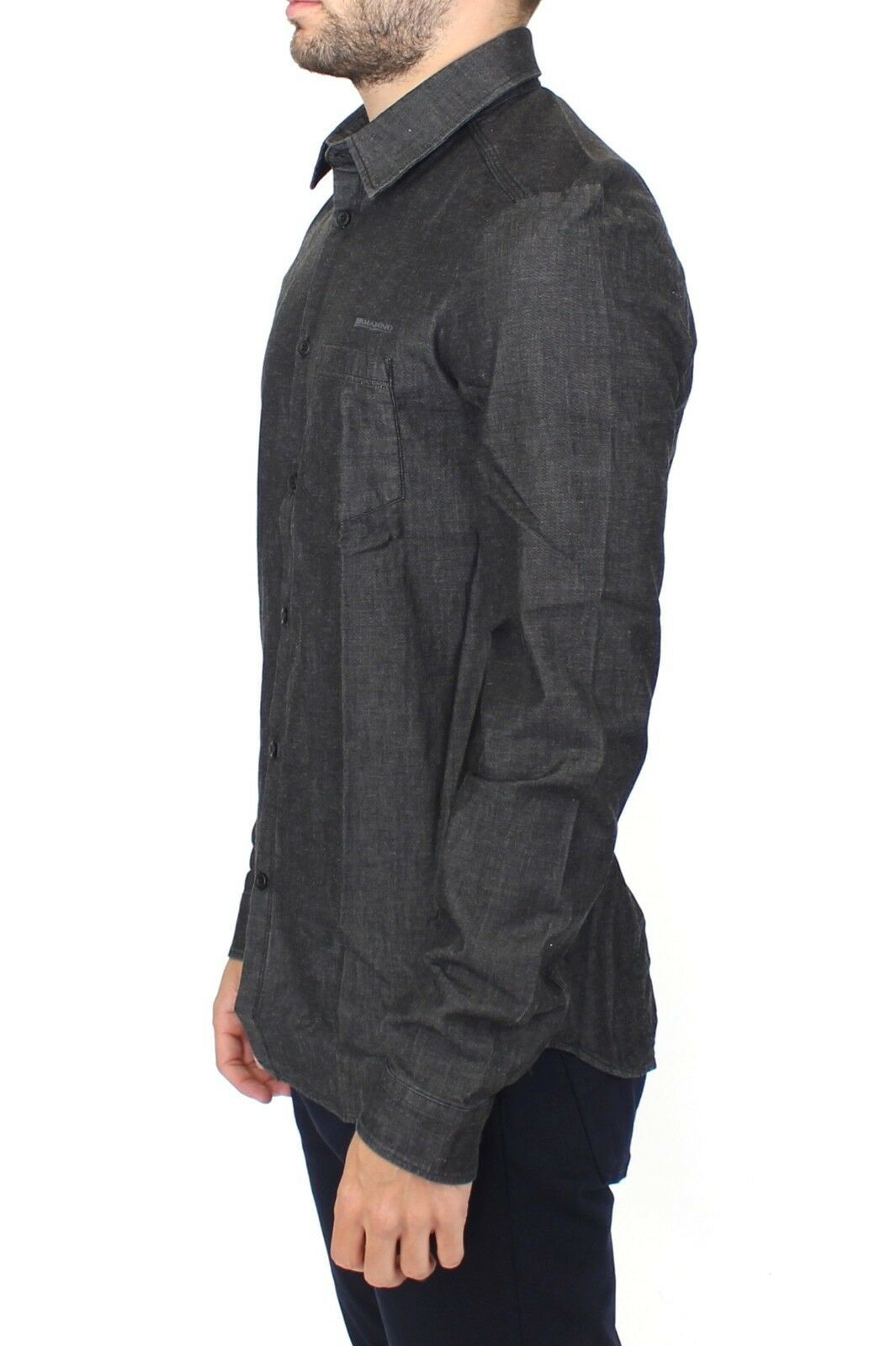 Man wearing dark shirt with rolled up sleeves