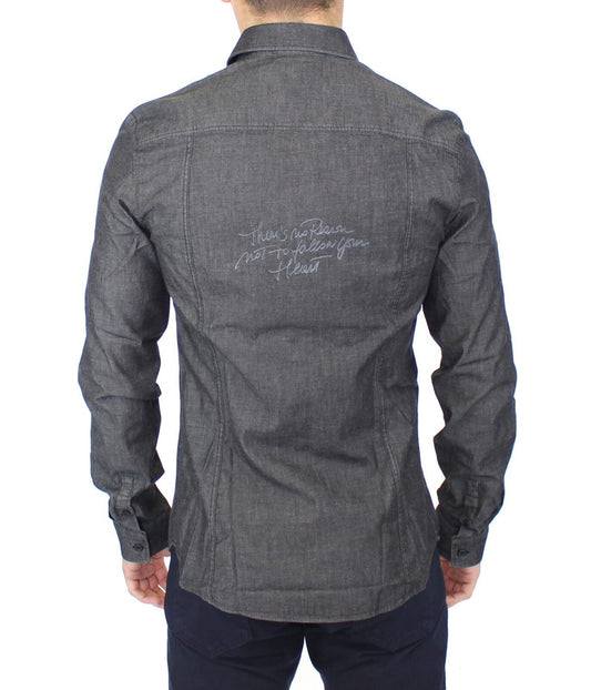 Man wearing dark denim jacket with autograph on back